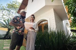 couple buying house and checking documents